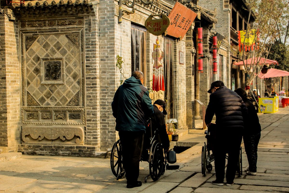 Travellers including wheelchair users exploring a city